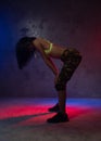 Young beautiful fashion Asian girl dancer in studio with neon lights Royalty Free Stock Photo