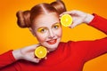 Young beautiful fashion model with Lemon. studio shot.