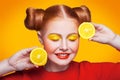 Young beautiful fashion model with Lemon. studio shot.