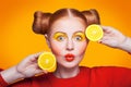 Young beautiful fashion model with Lemon. studio shot.