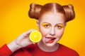 Young beautiful fashion model with Lemon. studio shot.