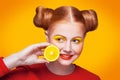 Young beautiful fashion model with Lemon. studio shot.