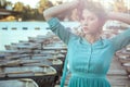 Young beautiful fashion model posing on pier. Royalty Free Stock Photo