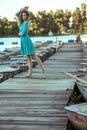 Young beautiful fashion model posing on pier. Royalty Free Stock Photo