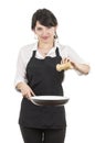 Young beautiful female chef wearing black apron Royalty Free Stock Photo