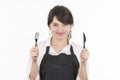 Young beautiful female chef wearing black apron Royalty Free Stock Photo