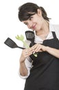 Young beautiful female chef wearing black apron Royalty Free Stock Photo