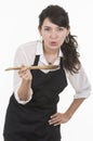 Young beautiful female chef wearing black apron Royalty Free Stock Photo