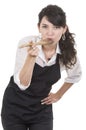 Young beautiful female chef wearing black apron