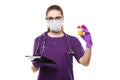 Young beautiful female doctor holding urine sample and tablet in her hands in medical mask and sterile gloves on white Royalty Free Stock Photo