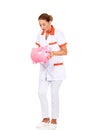 Young beautiful female doctor or nurse holding a piggybank