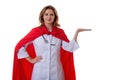 Young beautiful female hospital doctor superhero making presentation posture and showing open palm gesture face to camera isolated Royalty Free Stock Photo
