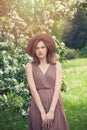 Young beautiful female model in hat outdoors. Cute woman spring portrait Royalty Free Stock Photo