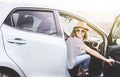 Young beautiful female travel girl in hat and sunglasses speaks