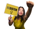 Young beautiful feminist Asian Korean girl holding protest billboard with resister text standing for women rights in female power Royalty Free Stock Photo