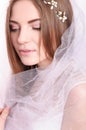 Young beautiful fiancee portrait with white veil.