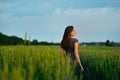 Young beautiful woman at summer meadow flowers Royalty Free Stock Photo