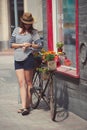 Young beautiful girl with aged bicycle