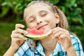 Young girl eating ripe watermelon Royalty Free Stock Photo