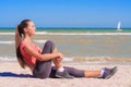 Young beautiful girl athlete playing sports on the beach Royalty Free Stock Photo