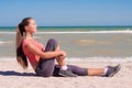 Young beautiful girl athlete playing sports on the beach Royalty Free Stock Photo