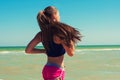 Young beautiful girl athlete playing sports on the beach Royalty Free Stock Photo