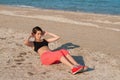 Young beautiful girl athlete playing sports on the beach Royalty Free Stock Photo