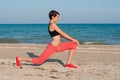 Young beautiful girl athlete playing sports on the beach Royalty Free Stock Photo