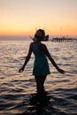 Young beautiful girl on the beach looking out to sea Royalty Free Stock Photo