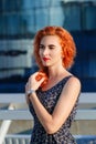 Young beautiful girl with beautiful appearance. Red-haired woman with a pretty face at sunset. A charming, smiling woman portrait Royalty Free Stock Photo