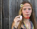 Young beautiful girl blowing bubbles outdoors. Royalty Free Stock Photo