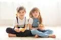 Young beautiful girl and boy, playing with little newborn chick Royalty Free Stock Photo