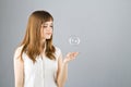 Young beautiful girl catch soap bubble Royalty Free Stock Photo