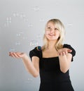 Young beautiful girl catch soap bubbles Royalty Free Stock Photo