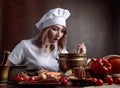 Young beautiful girl in a chef uniform with old brass pan and w Royalty Free Stock Photo