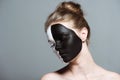 Young beautiful girl with closed eyes and creative white and black bodyart on face, Royalty Free Stock Photo