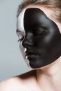 young beautiful girl with creative white and black bodyart on face, Royalty Free Stock Photo