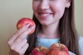 young beautiful girl eating an apple, close-up