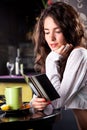 Young beautiful girl enjoying in cafe bar Royalty Free Stock Photo