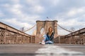 Young beautiful girl enjoying empty Brooklyn Bridge with a magical Manhattan island view Royalty Free Stock Photo