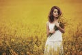 Young beautiful girl in the field Royalty Free Stock Photo