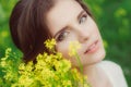 Young beautiful girl in field with yellow flowers Royalty Free Stock Photo