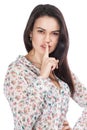 Young beautiful girl with a finger near lips Royalty Free Stock Photo