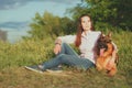 Young beautiful girl with a German shepherd playing on the lawn Royalty Free Stock Photo