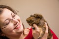 Young beautiful girl in glasses with her cute funny guinea pig Royalty Free Stock Photo