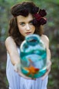 Young beautiful girl with gold fish Royalty Free Stock Photo