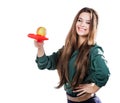 Young beautiful girl in a green blouse holding an apple with a tennis racket smiling. Apple wants to hit the racket. isolate Royalty Free Stock Photo