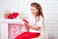 Young beautiful girl happy looking on her present box Royalty Free Stock Photo