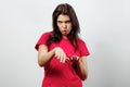 Young, beautiful girl having fun, dancing, showing the palms up. Isolated on a light background. Different human emotions, Royalty Free Stock Photo