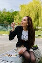 Young beautiful girl having lunch in the park Royalty Free Stock Photo